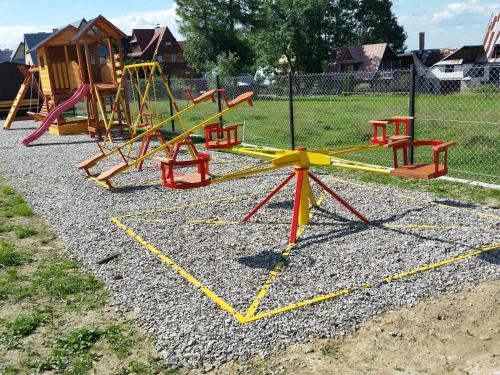 a group of playground equipment in a park at Dom Wczasowy Na Szczycie in Zakopane