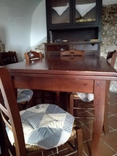 a wooden table with a chair and a desk at Cominium Benessere in Alvito