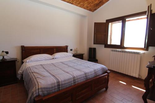 Postel nebo postele na pokoji v ubytování Hotel Il Feudo Dei Pierleoni