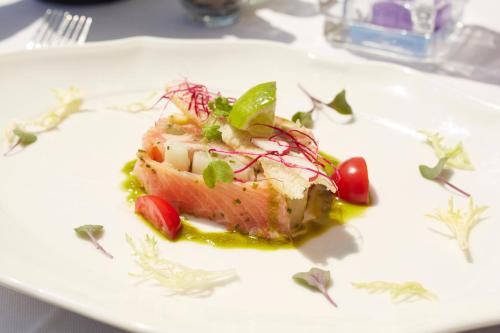 a piece of food on a plate on a table at Landhotel Heuvelzicht in Schin op Geul