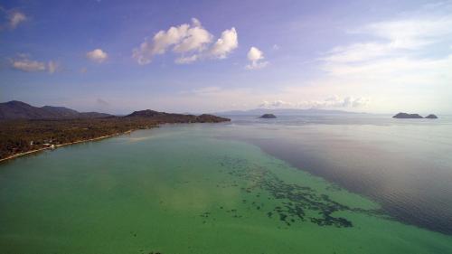 an aerial view of a large body of water at Bliss Villas in Srithanu