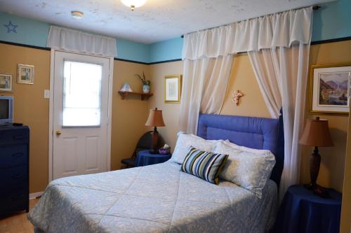 Ein Bett oder Betten in einem Zimmer der Unterkunft Gîte Marie-Claire