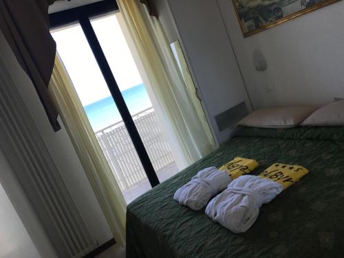 Postel nebo postele na pokoji v ubytování Hotel Byron