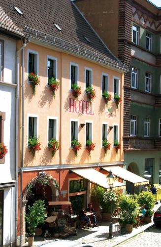 a hotel with a sign on the side of a building at Hotel Trendtino in Eisenberg