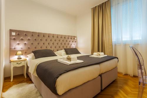 Cama ou camas em um quarto em Valum Luxury Apartment