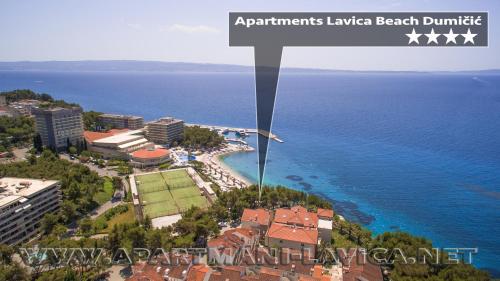 an aerial view of a beach and the ocean at Apartments Lavica Beach Dumičić in Podstrana