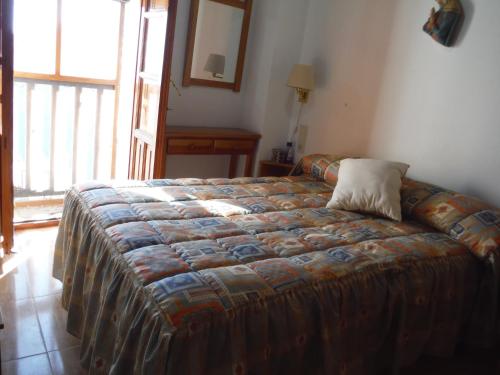 Tempat tidur dalam kamar di Casa Sierra Nevada