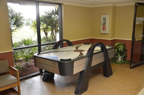 a room with a bed in front of a window at Orlando RV Resort in Orlando