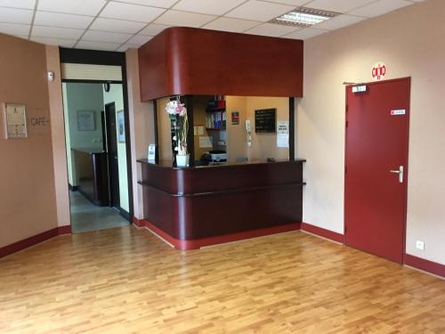 a lobby of a hospital with a waiting room at Hotel Dorele in Montargis