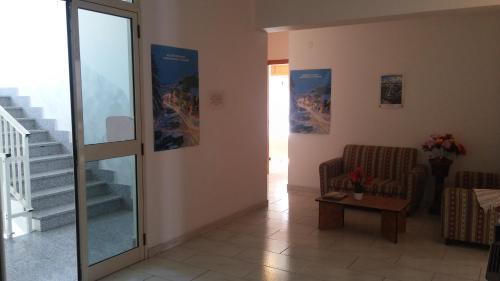 a living room with a couch and a table at Hotel Santa Caterina in Gizzeria