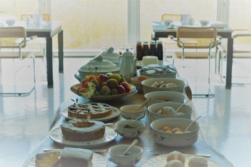 a table with different types of food on it at Antonello Colonna Resort & Spa in Labico