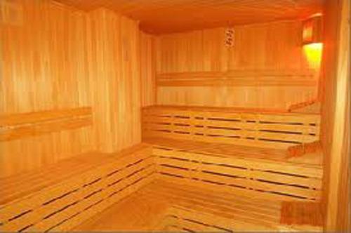 a sauna with two beds in a room at Monte Carlo Hotel in Alanya
