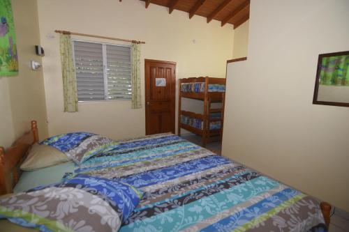 a bedroom with a bed and a window at Sunset Bay Club & SeaSide Resort in Salisbury