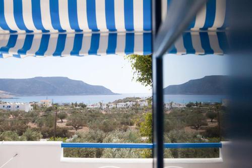 a view from a window with a view of the water at Vardes Hotel Studios in Amoopi