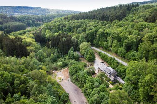 an aerial view of a train in the middle of a forest at Auberge Au Naturel des Ardennes in Rochehaut