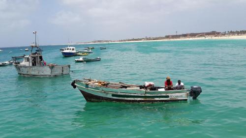 a group of people on a boat in the water at Sal Apartments Djadsal Moradias in Santa Maria