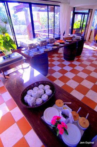 a table with a bunch of food on it at Hotel Rancho Constanza & Cabañas de la Montaña in Constanza