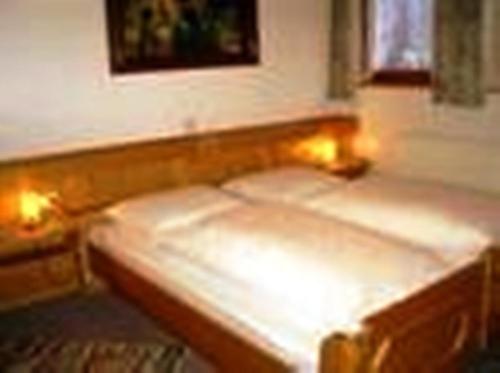 two beds in a room with lights on them at Ferienwohnung Zick in Sankt Gallenkirch