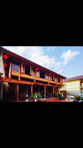 a building with red flags on the side of it at Bac Ha Lake View in Bắc Hà