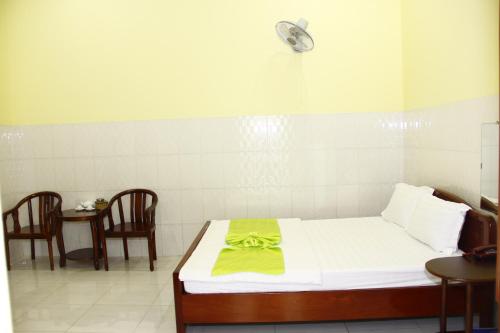 a hospital room with a bed with a yellow towel on it at Tan My Thien Hotel in Tây Ninh