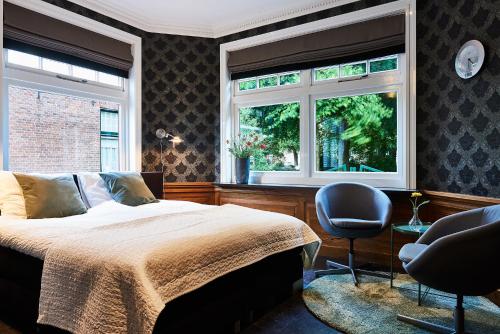 Postel nebo postele na pokoji v ubytování Guesthouse Villa Emmen