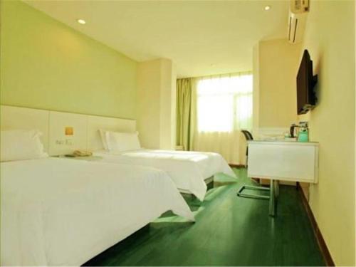Säng eller sängar i ett rum på Jinjiang Inn Select Taiyuan Changfeng Street