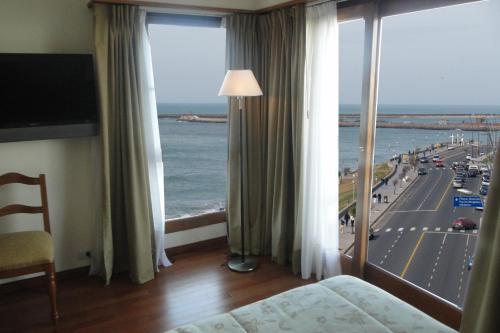 
a hotel room with a view of the ocean at Hotel Amsterdam in Mar del Plata
