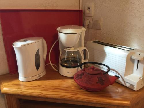 a counter with a coffee maker and a blender on it at Chalet Rouge Sorbier in Font-Romeu
