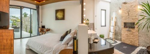 Postel nebo postele na pokoji v ubytování Bliss Villas