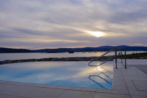 a swimming pool with a view of a body of water at Portavadie Loch Fyne Scotland in Portavadie