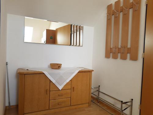 a bathroom with a sink and a mirror at Ferienhof Kehlbauer in Hof bei Salzburg