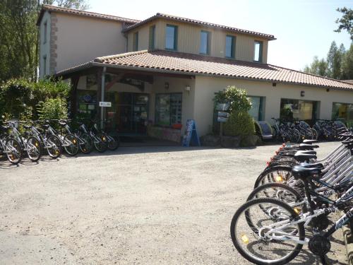 a group of bikes parked in front of a building at Pescalis Résidence Les Maisons du Lac in Moncoutant