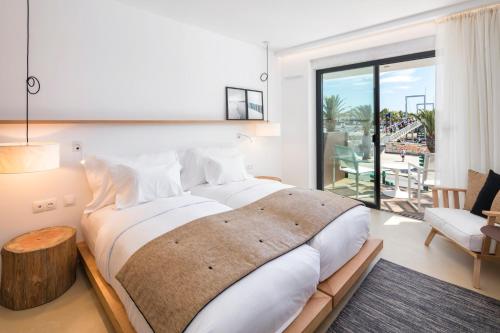 Ein Bett oder Betten in einem Zimmer der Unterkunft Lagos Avenida Hotel