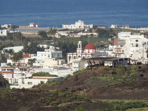 a group of white buildings on top of a hill at Los Jazmines in Agaete