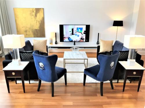 TV a/nebo společenská místnost v ubytování MONDRIAN Luxury Suites & Apartments Market Square IV