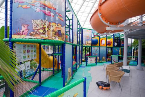 a large indoor playground with a slide at Aquaticum Debrecen Termal & Wellness Hotel in Debrecen