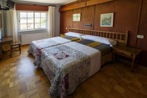 Postel nebo postele na pokoji v ubytování As Areas II