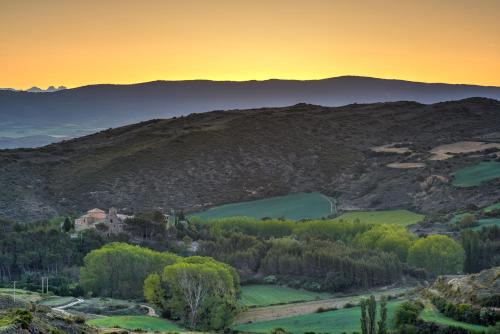 a view of a mountain with a sunset in the background at Parador de Sos del Rey Católico in Sos del Rey Católico