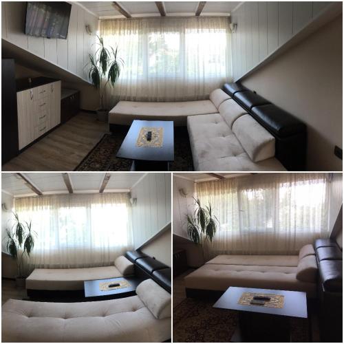 a living room with a couch and a table at Guest House Angelkovi in Sapareva Banya