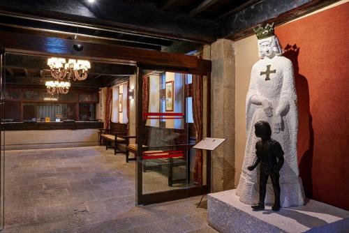 a statue of a woman with a crown on her head in a museum at Parador de Sos del Rey Católico in Sos del Rey Católico