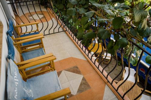 an overhead view of a balcony with chairs and plants at Kalypso Hotel in Primorsko