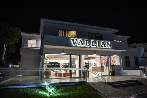 a building with a sign that reads valeeland at Vallian Village Hotel in Paradeísion