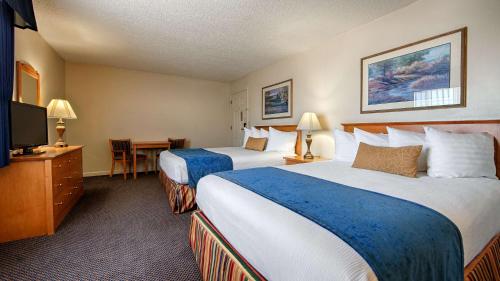 Ένα ή περισσότερα κρεβάτια σε δωμάτιο στο Trailside Inn