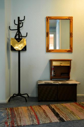 a room with a mirror and a table with a dresser at Roosi Holiday Home in Rannaküla
