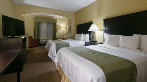 a hotel room with two beds and a television at Best Western Plus Port of Camas-Washougal Convention Center in Washougal