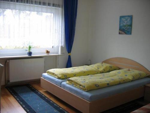 Ein Bett oder Betten in einem Zimmer der Unterkunft Wohnung Gorch Fock in Cuxhaven an der Nordsee 