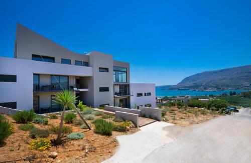 a building with a view of the water at Seametry Apartments in Souda