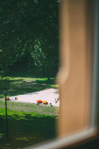 a view of a flooded field from a window at Pałac Poraj in Wicko
