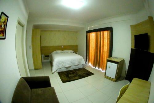 Katil atau katil-katil dalam bilik di Morangos Hotel