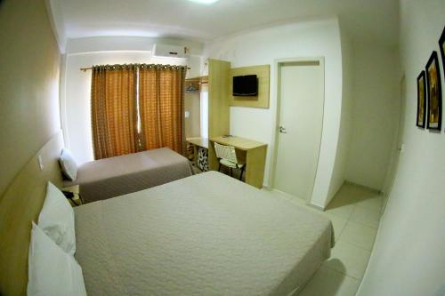 Krevet ili kreveti u jedinici u objektu Morangos Hotel